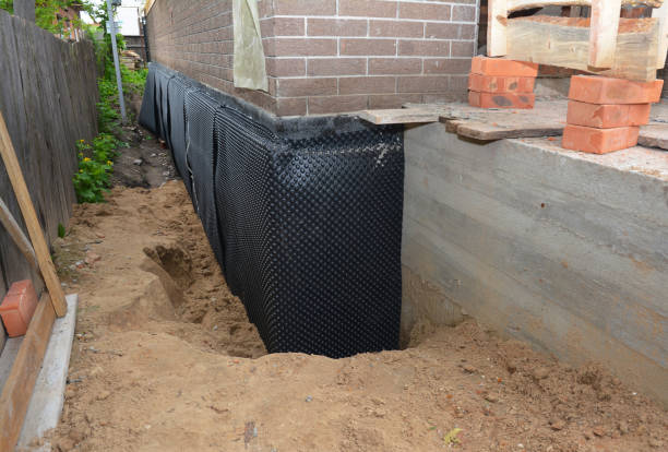 SJ Waterproofing Pros technician performing targeted Emergency Waterproofing assessment in Lavallette, NJ